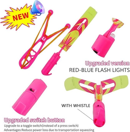 25 Packs LED Flying Toys Set with Whistle,25 Rocket Slingshot+25 Glow Arrow Helicopter for Summer Outdoor Camping Toys Game LED Slingshot Toy for Kids Glow in The Dark Party Supplies 8-12,4-8